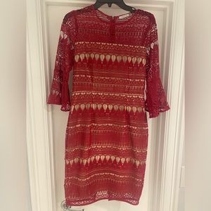 Size 6 Cranberry color lace dress with nude lining and flared sleeves